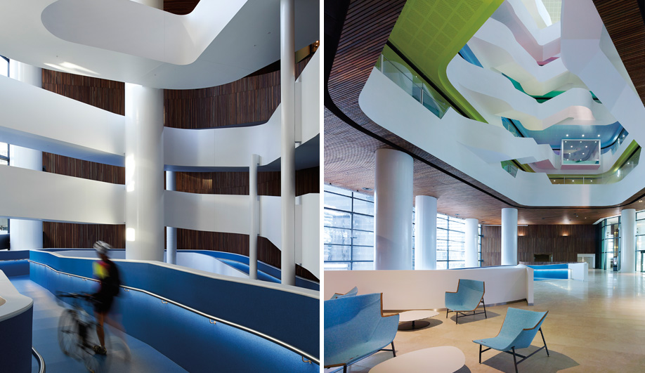 Left: A ribbon-like blue ramp traverses four levels and invites employees to bring their bikes into the building’s storage facility. Right: The atrium’s spiral of colour-coded ceilings and floors are an effective wayfinding feature for navigating the seven floors where 1,600 employees now work.