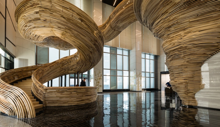 A Sculptural Staircase Swirls Through a Tel Aviv Lobby
