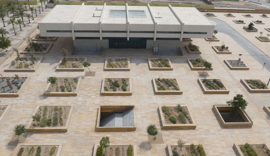 A grid of planters filled with native desert foliage surrounds Qatar National Library, which is slated to open later this year. 