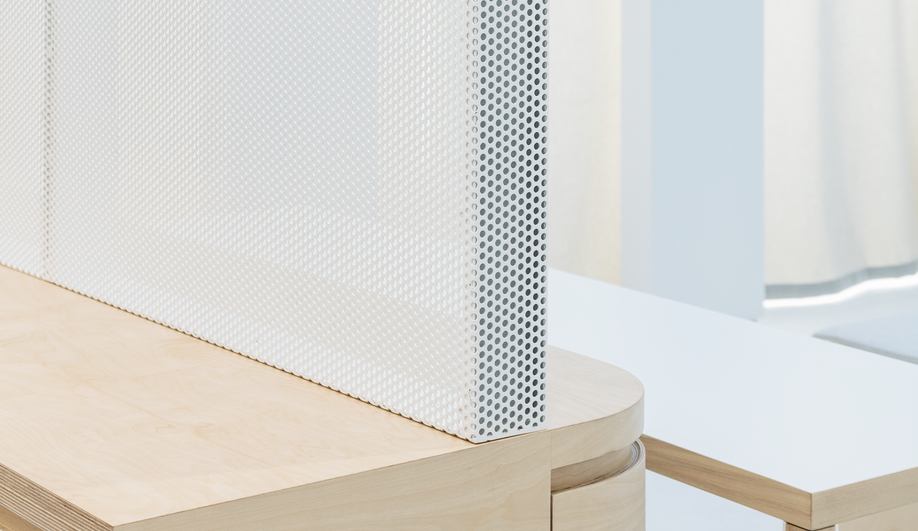 The Everlane flagship maintains its translucency with perforated metal dividers.