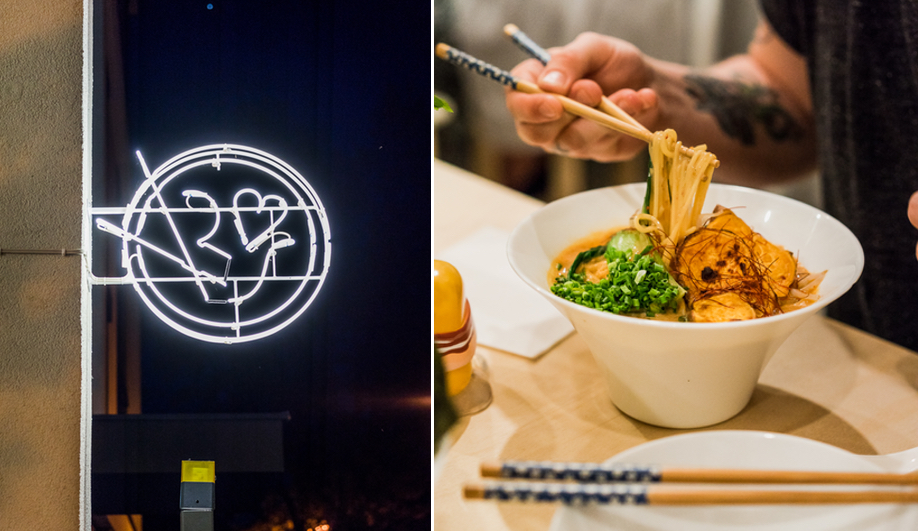 A pictographic neon sign welcomes visitors to Warsaw's Vegan Ramen Shop.