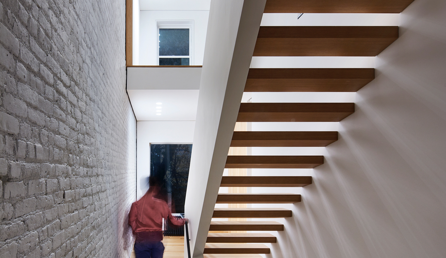 A Row House Transformed By A Set of Switchback Stairs