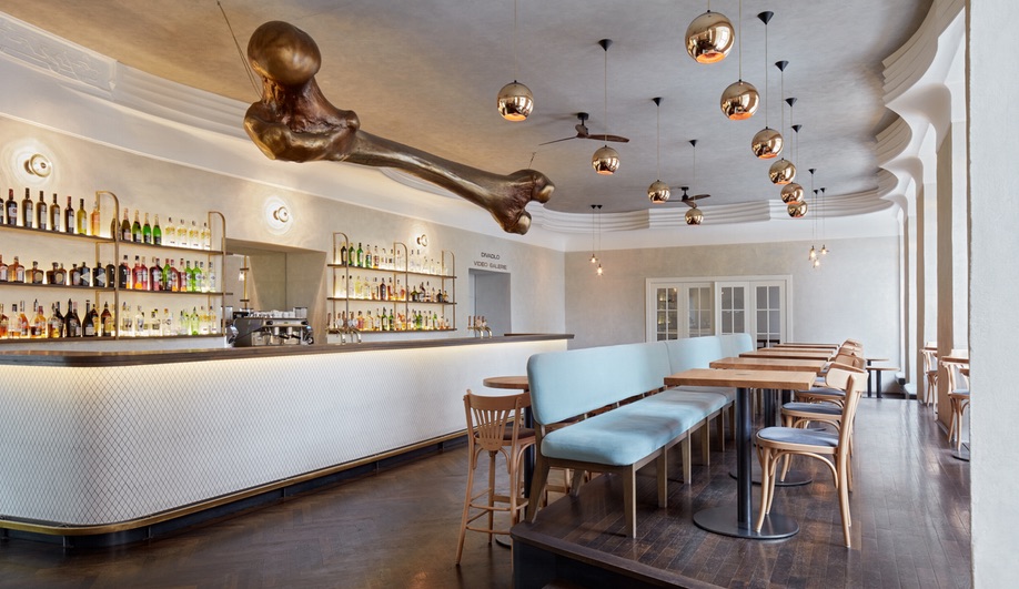 Prague’s NoD Cafe is Defined by a Giant Bone-Shaped Sculpture