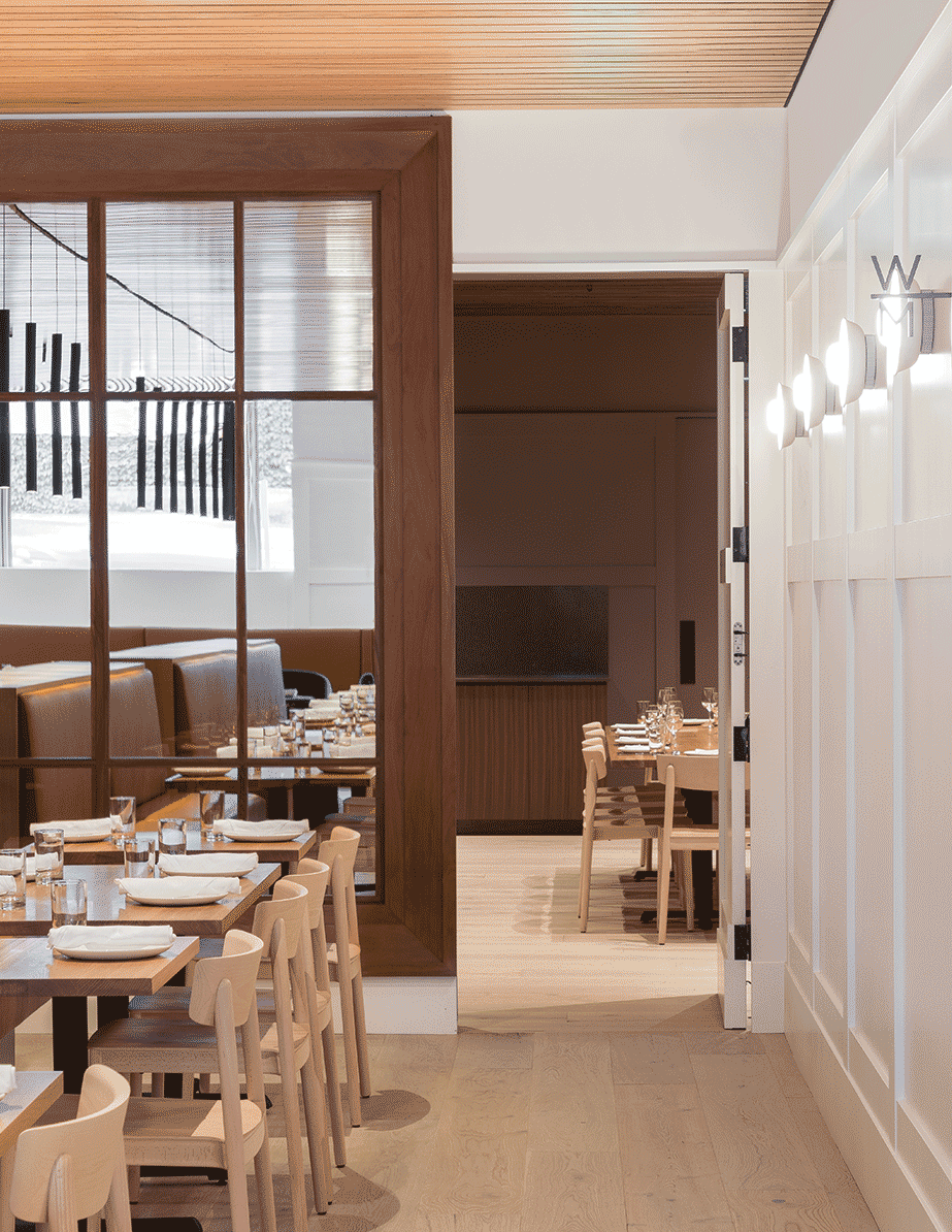 A retractable door in Seattle restaurant Cortina, designed by Heliotrope Architects